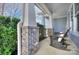 Inviting front porch offers rocking chairs, brick columns, and relaxing outdoor space at 2030 Bosna Ln, Fort Mill, SC 29715