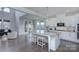 Spacious open kitchen with an island, stainless steel appliances, and seamless flow to the living area at 2030 Bosna Ln, Fort Mill, SC 29715