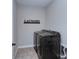 Modern laundry room with front-loading washer and dryer, with laundry signage at 2030 Bosna Ln, Fort Mill, SC 29715