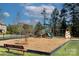 A vibrant community playground featuring swings, slides, and climbing structures, all surrounded by a secure black fence at 2030 Bosna Ln, Fort Mill, SC 29715