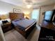 Comfortable bedroom featuring rustic wood accents, soft lighting, and neutral tones for a relaxing retreat at 205 Cooke Cir, Kings Mountain, NC 28086
