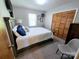 Cozy bedroom with closet, soft carpet, and a serene setting for restful nights and relaxed mornings at 205 Cooke Cir, Kings Mountain, NC 28086