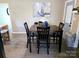 Cozy dining area with dark wood table, seating for four, and stylish decor at 205 Cooke Cir, Kings Mountain, NC 28086