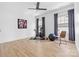 Exercise room with hardwood floors, ceiling fan, and natural light from two windows at 210 Walford Dr, Charlotte, NC 28208