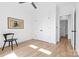 Bedroom with hardwood floors, simple decor, and double door closet at 210 Walford Dr, Charlotte, NC 28208
