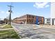 Exterior shot of a brick building with large windows, signage, and street access at 210 Walford Dr, Charlotte, NC 28208