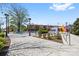 Exterior featuring landscaping, streetlights, seating, and a colorful building in the background at 210 Walford Dr, Charlotte, NC 28208