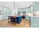 Modern kitchen with a center island, stainless steel appliances, custom cabinets, and a cozy breakfast nook at 210 Walford Dr, Charlotte, NC 28208