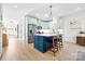 Stylish kitchen featuring custom cabinets, stainless appliances, a center island with seating, and bright ambiance at 210 Walford Dr, Charlotte, NC 28208