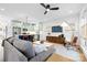 Open-concept living room with a modern kitchen featuring stainless steel appliances and a center island at 210 Walford Dr, Charlotte, NC 28208