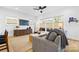 Bright living room with hardwood floors, stylish furniture, and large windows, offering comfortable seating at 210 Walford Dr, Charlotte, NC 28208
