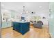 Open-concept living area with modern kitchen, comfortable seating, and large windows for ample natural light at 210 Walford Dr, Charlotte, NC 28208