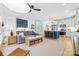 Inviting open-concept living area with modern decor, stylish furniture, and seamless flow to the kitchen at 210 Walford Dr, Charlotte, NC 28208