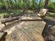 Large wooden deck with built-in seating, perfect for outdoor relaxation and entertaining at 2213 Wheaton Way, Monroe, NC 28112