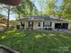 Inviting one-story home with a garage, a well-kept lawn, and mature trees at 2213 Wheaton Way, Monroe, NC 28112