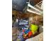 A cluttered bedroom showcases personal items strewn around a bed, dresser, and makeshift shelving at 2504 Windswept Way, Rockwell, NC 28138