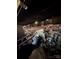 A dark crawlspace includes debris and support materials of a manufactured home at 2504 Windswept Way, Rockwell, NC 28138