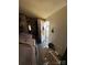 View of a cluttered hallway with an open doorway and an exterior view at 2504 Windswept Way, Rockwell, NC 28138