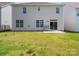 Expansive backyard with a well-maintained lawn leading to a patio, offering ample space for outdoor entertainment at 3042 Burnello Ct, Iron Station, NC 28080