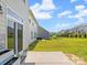 Relax on the patio, overlooking a well-kept lawn with a secure fence, ideal for privacy and outdoor enjoyment at 3042 Burnello Ct, Iron Station, NC 28080