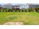 Spacious backyard featuring a lush lawn, fence, and a deck perfect for outdoor activities and relaxation at 3042 Burnello Ct, Iron Station, NC 28080