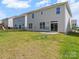 This large, grassy backyard offers plenty of room for recreation. A patio provides an ideal spot for relaxation at 3042 Burnello Ct, Iron Station, NC 28080