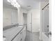 A bright bathroom features granite countertops, white cabinets, and a tub at 3042 Burnello Ct, Iron Station, NC 28080