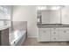 Bright bathroom featuring a soaking tub and double sink vanity with granite countertops at 3042 Burnello Ct, Iron Station, NC 28080