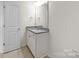 Bathroom featuring granite countertop vanity, sink, and a well-lit mirror at 3042 Burnello Ct, Iron Station, NC 28080