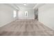 Spacious bedroom with neutral carpet, trim and tray ceiling features one large window and open entry at 3042 Burnello Ct, Iron Station, NC 28080