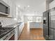 Gourmet kitchen featuring stainless steel appliances and a large island at 3042 Burnello Ct, Iron Station, NC 28080