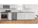 Well-equipped kitchen with stainless steel appliances and white cabinets at 3042 Burnello Ct, Iron Station, NC 28080