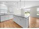 Bright, open kitchen with a large island, granite countertops, and stainless steel appliances at 3042 Burnello Ct, Iron Station, NC 28080