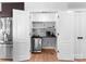 Convenient butler's pantry with wine rack, mini-fridge, and countertop space, perfect for entertaining at 315 Arlington Ave # 506 & 507, Charlotte, NC 28203