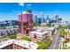 A cityscape view with the pink condo building and a view of the Charlotte, NC skyline at 315 Arlington Ave # 506 & 507, Charlotte, NC 28203