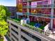 View of a rooftop patio in a modern condo building with parking garage and patio furniture at 315 Arlington Ave # 506 & 507, Charlotte, NC 28203