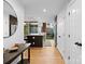 Elegant kitchen and hallway featuring hardwood floors, modern appliances, and ample natural light, perfect for cooking and entertaining at 315 Arlington Ave # 506 & 507, Charlotte, NC 28203
