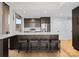Modern kitchen island with marble countertops and bar stool seating, plus stainless steel appliances at 315 Arlington Ave # 506 & 507, Charlotte, NC 28203