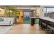 Kitchen and living space featuring marble countertops, bar stool seating, and access to an outdoor patio at 315 Arlington Ave # 506 & 507, Charlotte, NC 28203