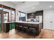 Modern kitchen with island seating, stainless steel appliances, and oversized windows bringing in lots of light at 315 Arlington Ave # 506 & 507, Charlotte, NC 28203