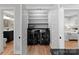 Convenient laundry area with modern black washer and dryer, built-in shelving, and ample storage space at 315 Arlington Ave # 506 & 507, Charlotte, NC 28203