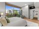 Bright main bedroom with a large window showcasing outdoor views and built in storage at 315 Arlington Ave # 506 & 507, Charlotte, NC 28203