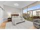 Bright main bedroom with hardwood floors, large windows, and comfortable furnishings at 315 Arlington Ave # 506 & 507, Charlotte, NC 28203