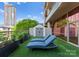 Relaxing rooftop patio featuring lounge chairs, lush greenery, and a stylish storage shed for comfortable outdoor living at 315 Arlington Ave # 506 & 507, Charlotte, NC 28203