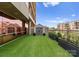 Stylish rooftop patio featuring a storage shed, lush greenery, and modern railings, creating a serene outdoor retreat at 315 Arlington Ave # 506 & 507, Charlotte, NC 28203