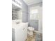 Freshly painted bathroom with a white vanity, a toilet, a tiled shower with shower curtain, and a window at 3203 Valleydale Rd, Monroe, NC 28110