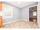 Sunlit dining area featuring neutral walls, tiled flooring, and a window for natural light at 3203 Valleydale Rd, Monroe, NC 28110