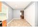 Bright dining area with a large window, closet space, and tiled floors at 3203 Valleydale Rd, Monroe, NC 28110