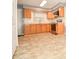 Functional kitchen featuring oak cabinets, laminate countertops, and modern appliances for a practical cooking space at 3203 Valleydale Rd, Monroe, NC 28110