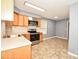 Functional kitchen featuring modern appliances, oak cabinets, and laminate countertops, maximizing space and efficiency at 3203 Valleydale Rd, Monroe, NC 28110